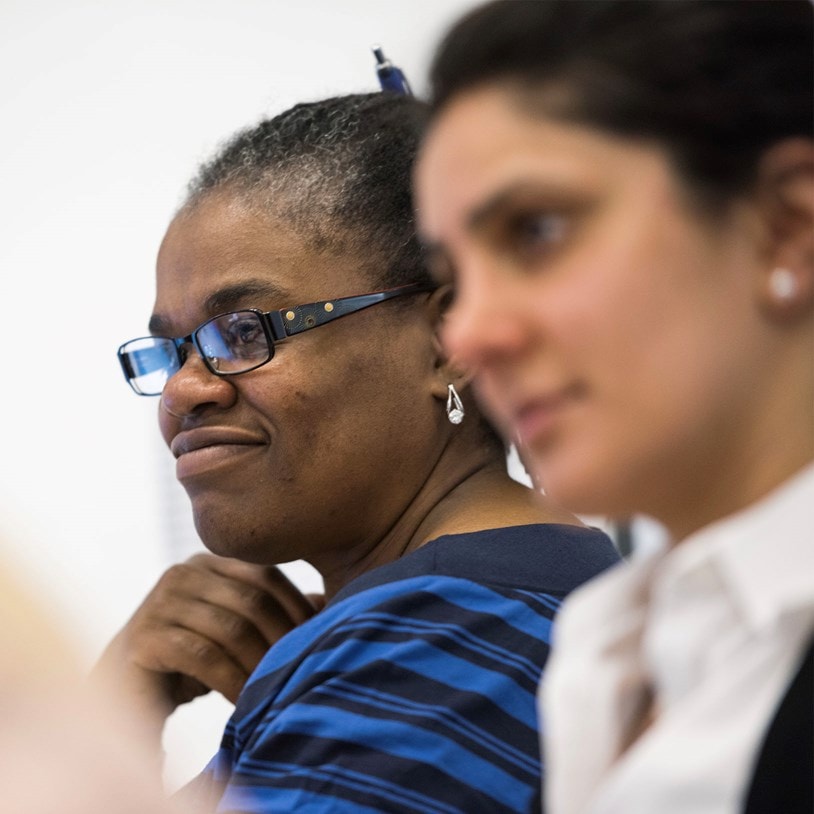 Two smiling female office workers
