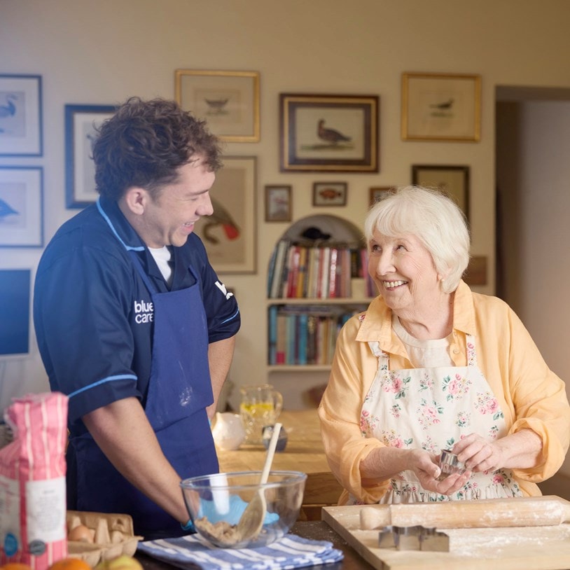 female customer and carer baking in kitchen