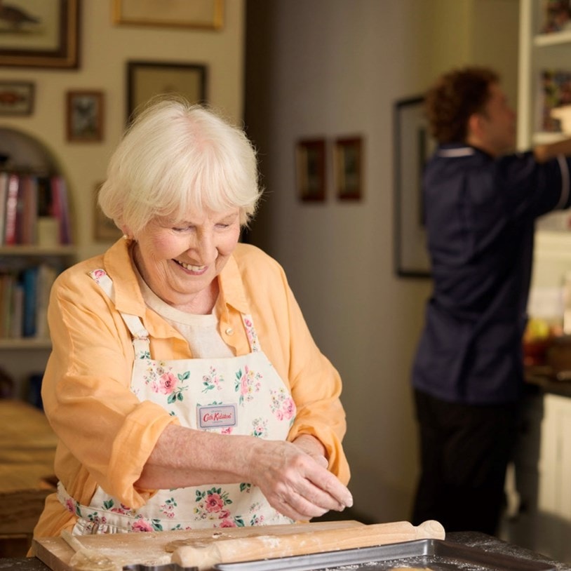 customer baking with care expert in background