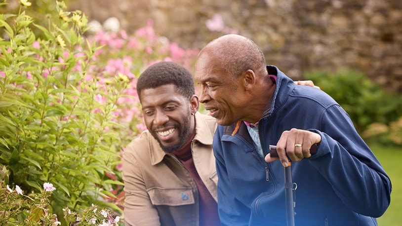 male customer and carer looking at flowers