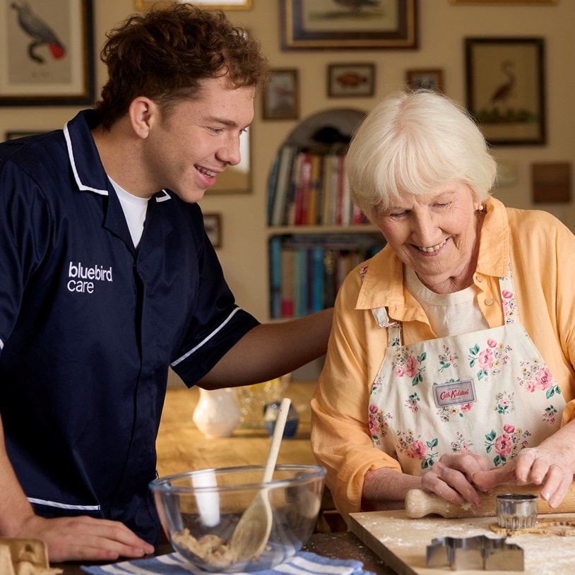 Care Expert supporting customer with baking