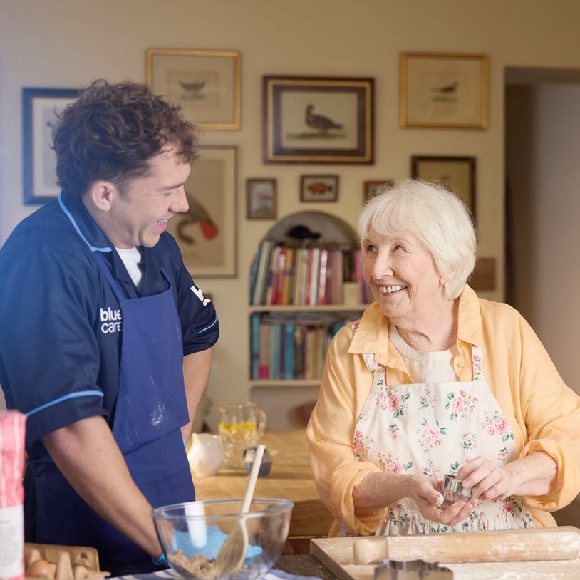 female customer and carer baking in kitchen
