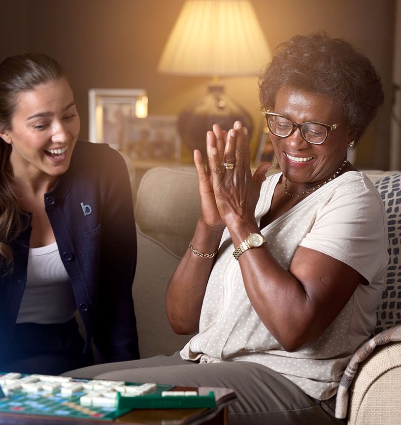 care expert and female customer playing scrabble