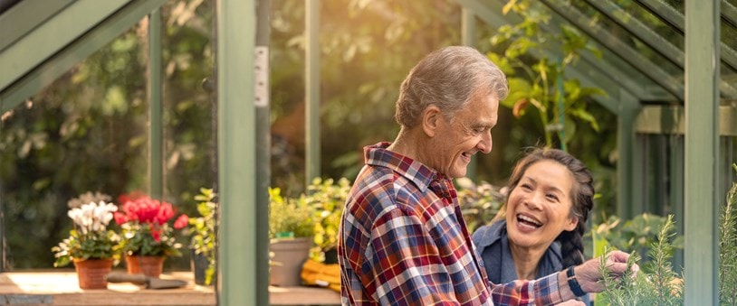male customer and carer in greenhouse