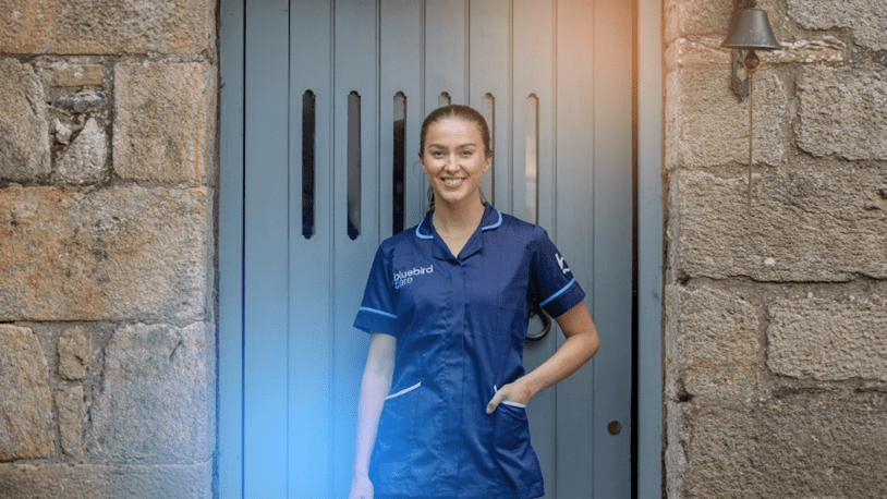 Carer in front of a customers home