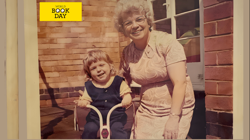 Granddaughter on a tricycle with her Grandmother