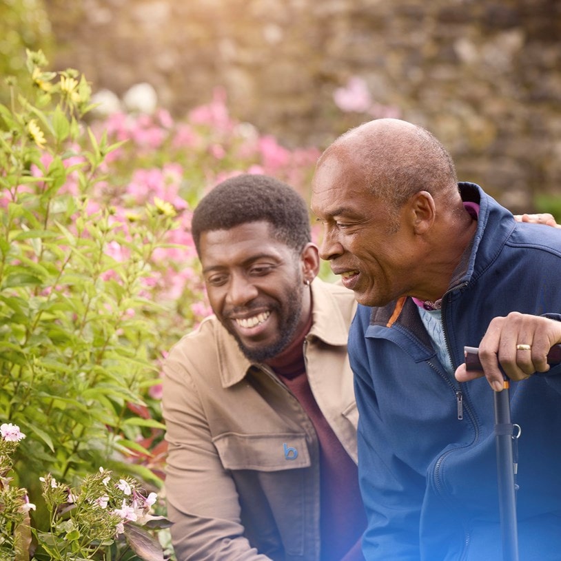 male customer and carer looking at flowers