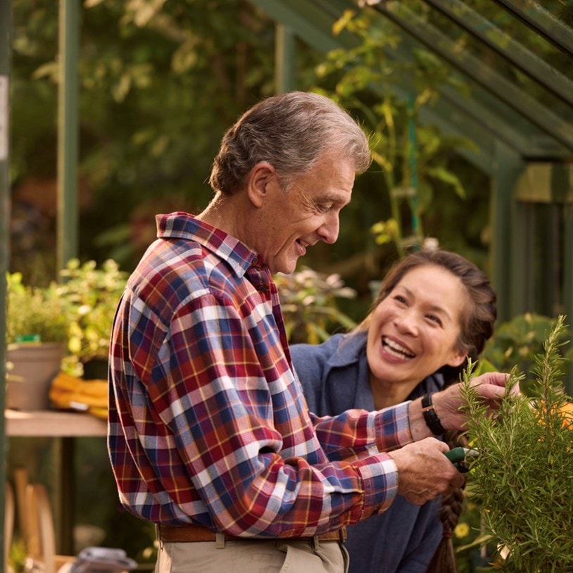 male customer in greenhouse with live-in care expert