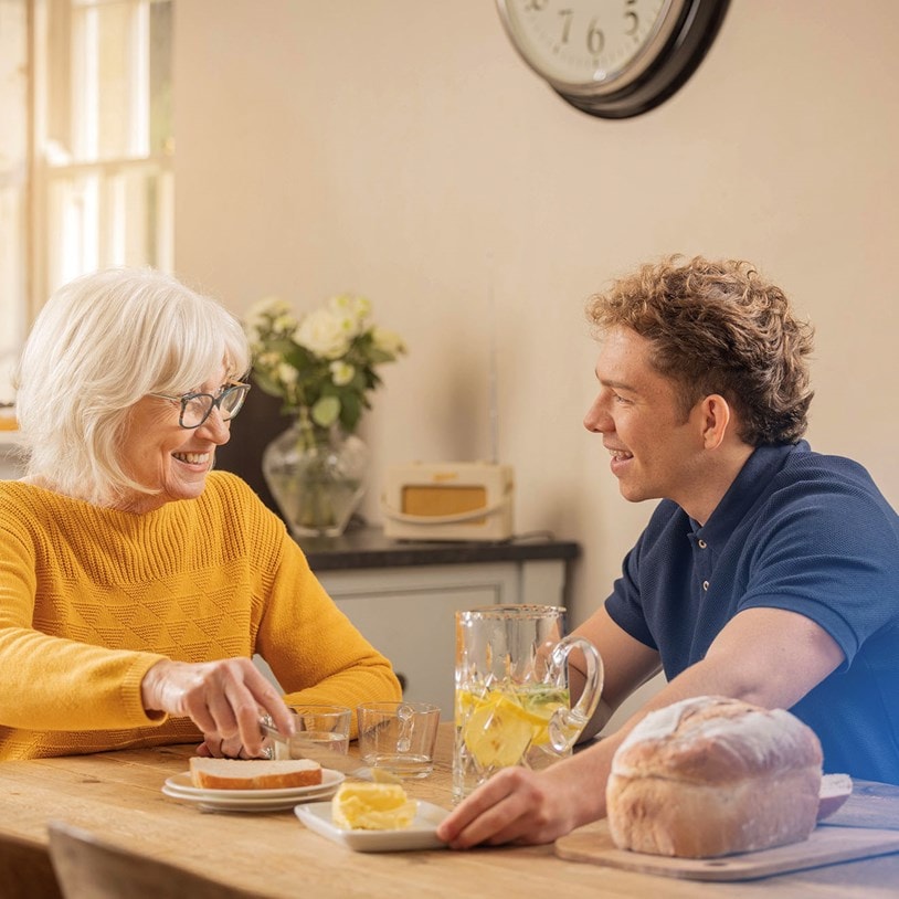 female customer and carer having breakfast