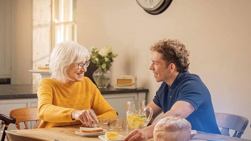 female customer and carer having breakfast