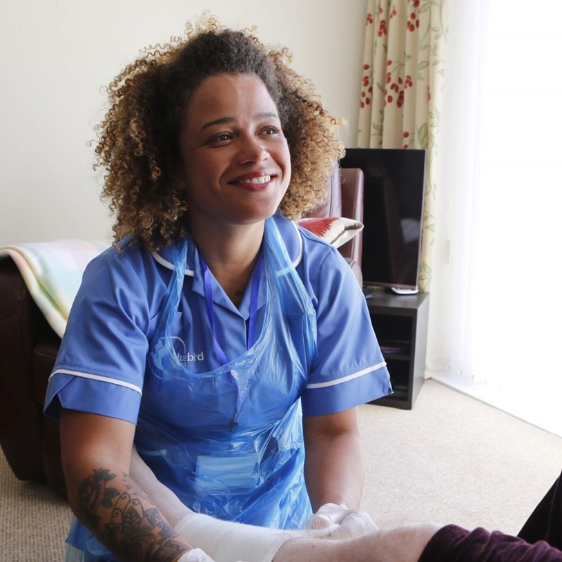 Care expert in uniform and PPE