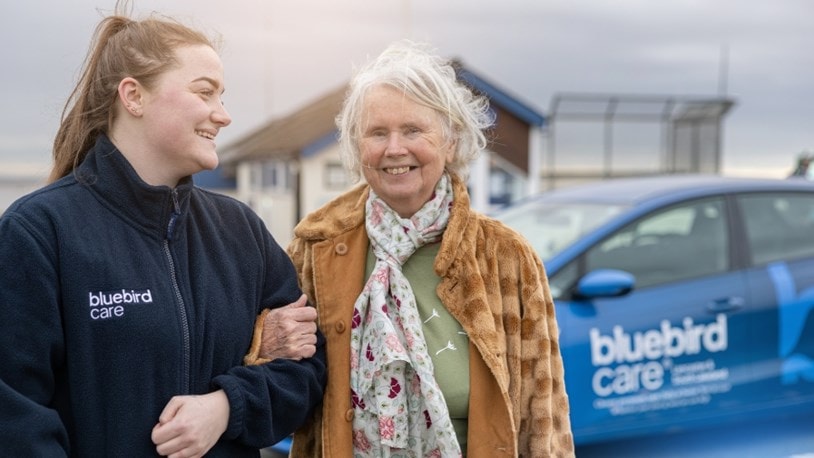 Elderly lady on an outing with a carer