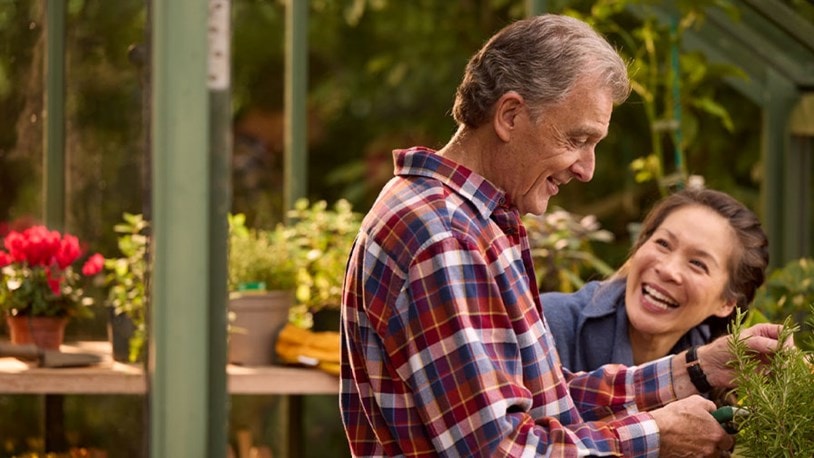 male customer in greenhouse with live-in care expert
